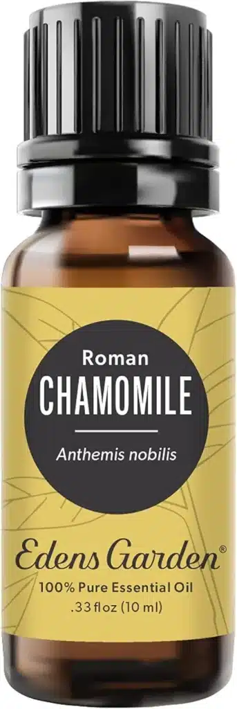 A brown bottle with a black label of chamomile oil